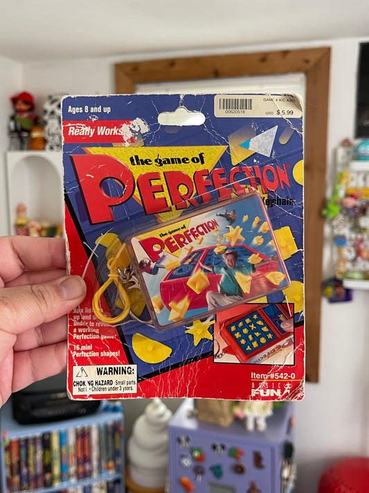 2000's The Game Of Perfection mini game keychain