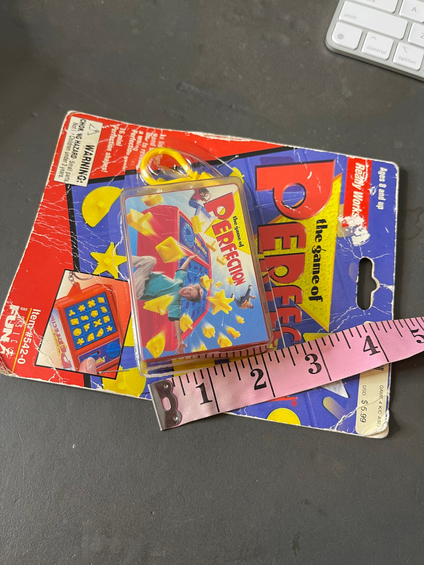 2000's The Game Of Perfection mini game keychain