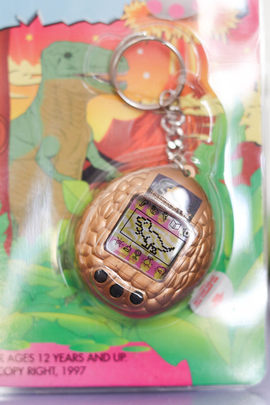 Vintage Deadstock 90s Gold DinoPet Tamagotchi Keychain