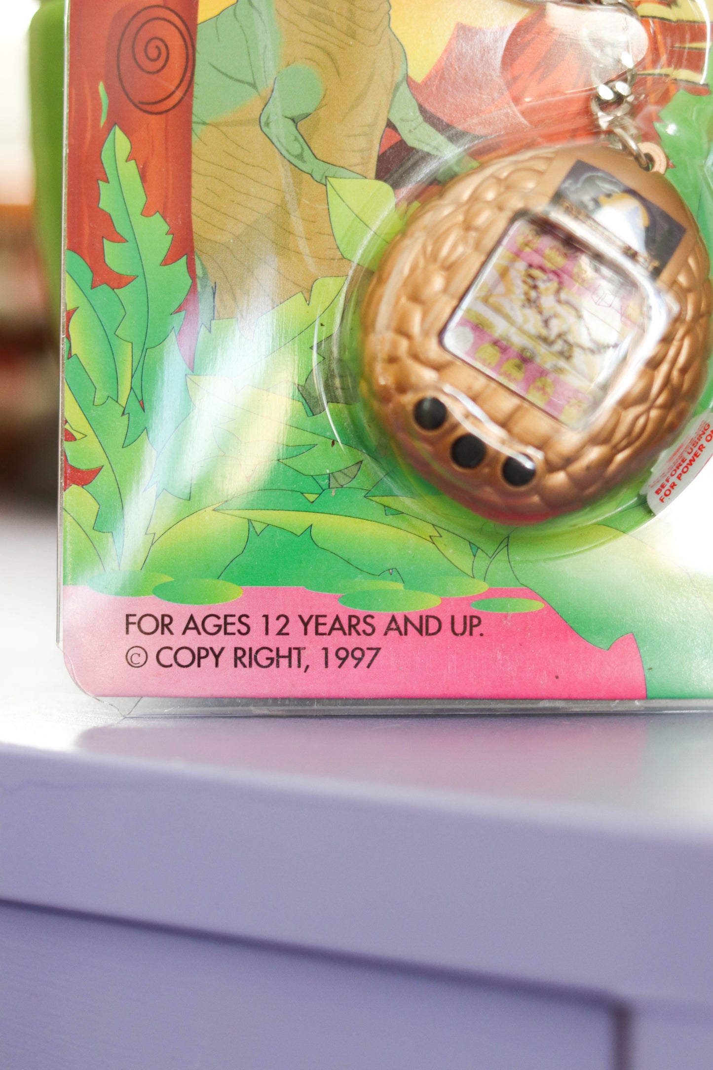 Vintage Deadstock 90s Gold DinoPet Tamagotchi Keychain